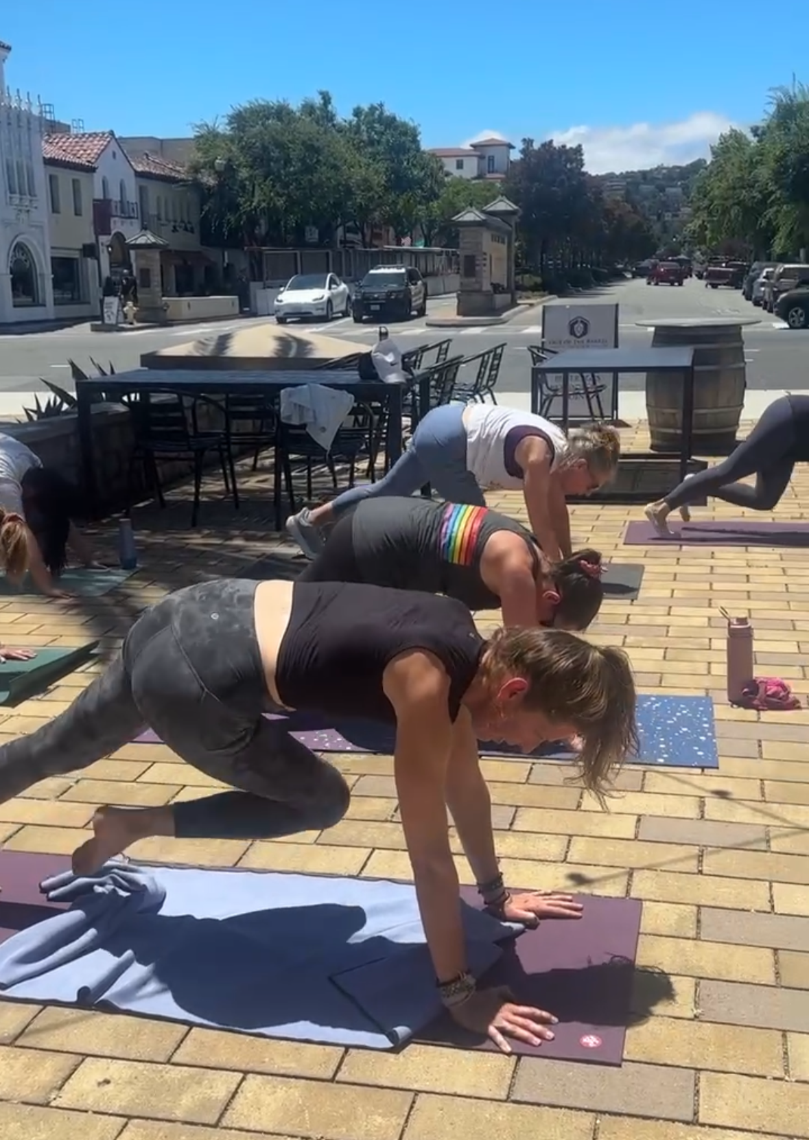 YHC community class participants practicing on mats at Out of the Barrel