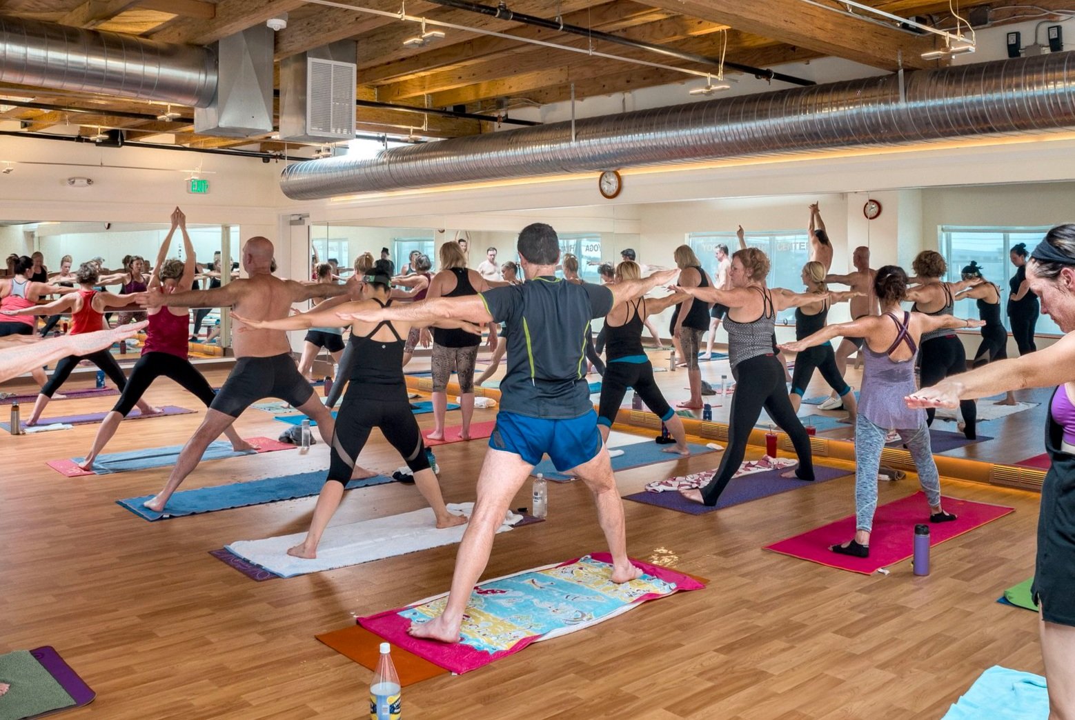 A full Yoga Health Center class practicing together